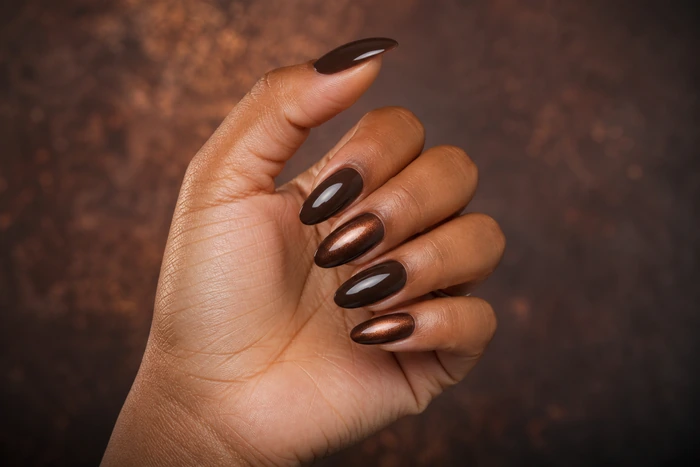 Medium almond espresso acrylic nails with a copper aura halo