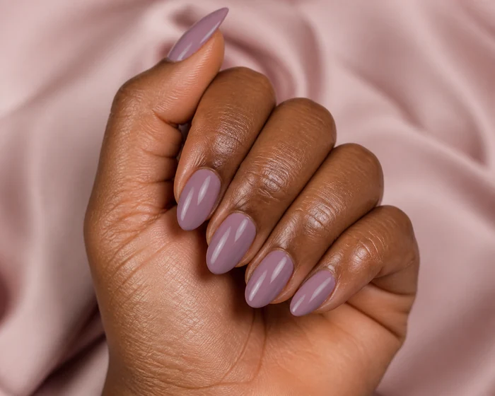 Dusty mauve almond pretty fall nails in a hand-only close-up