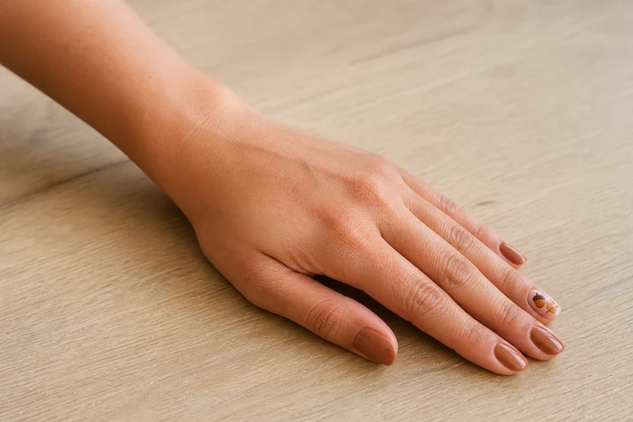 Tiny acorn accent nail art for cute fall nails