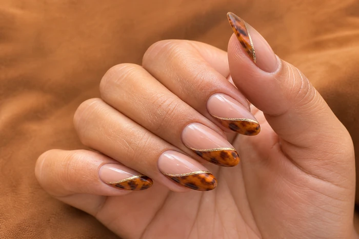 Caramel almond nails with tortoiseshell French and gold line