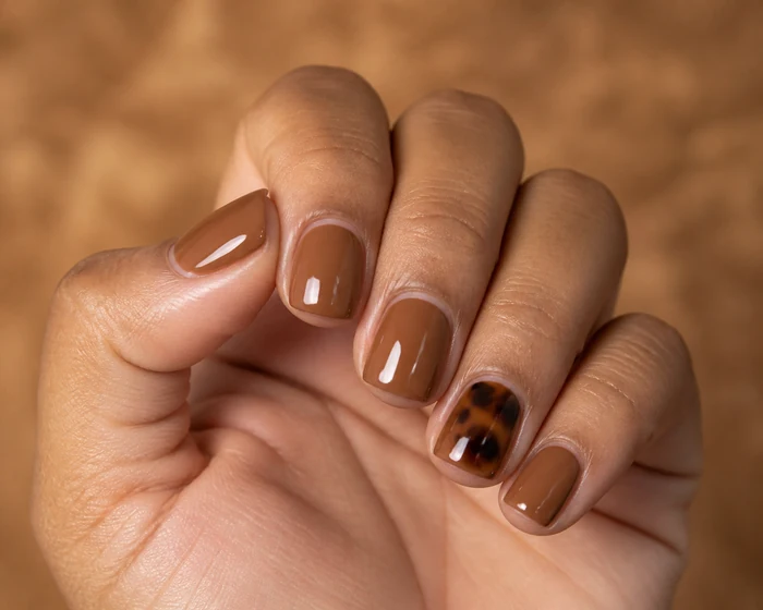 Short caramel square nails with tortoiseshell cuticle accent