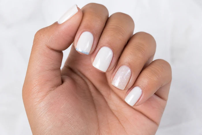 Milk white simple winter nails with icy blue micro French