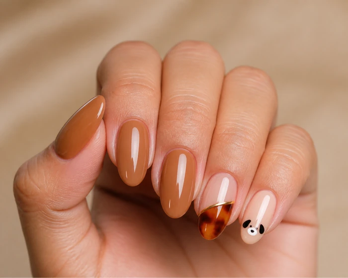 Caramel Thanksgiving nails with Snoopy accent and tortoiseshell