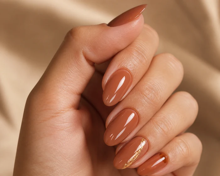 Terracotta Thanksgiving gel nails with gold leaf line