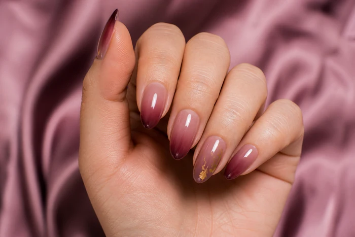Mauve plum ombre almond nails with gold foil