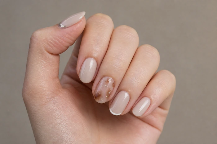 Neutral winter nails with tortoiseshell accent and micro French tips