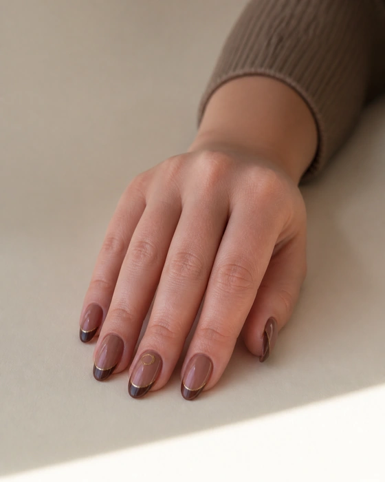 Mocha chocolate French nails with a thin gold line
