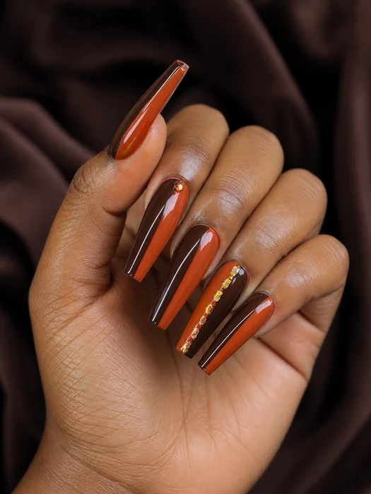 Long cocoa and pumpkin coffin acrylic nails with gold foil