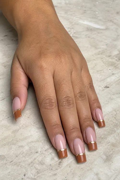 Caramel French square nails with slim gold lines