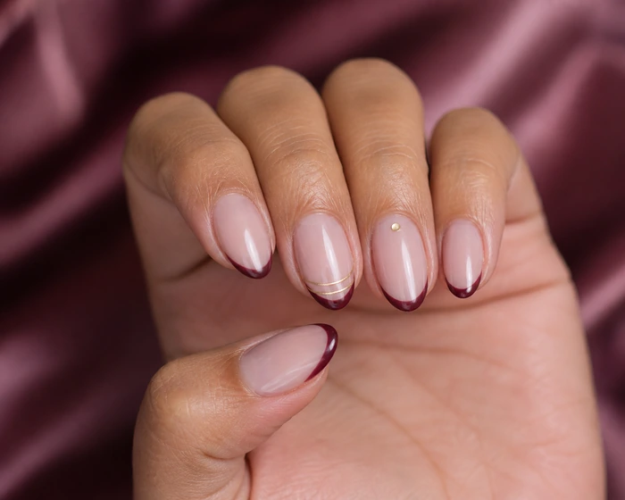 Wine micro-French nails with a slim champagne double line