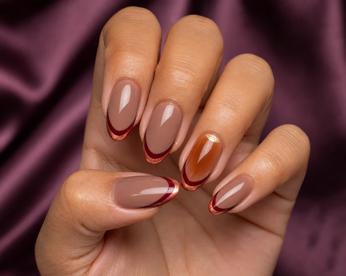 Cranberry and copper French tip almond nails