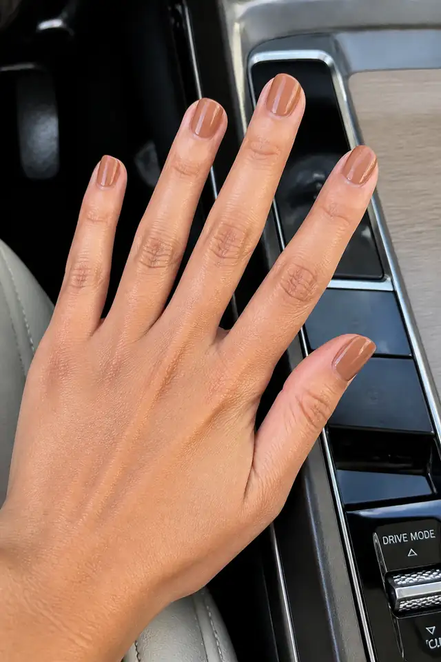 Caramel strengthening gel overlay on short natural nails.