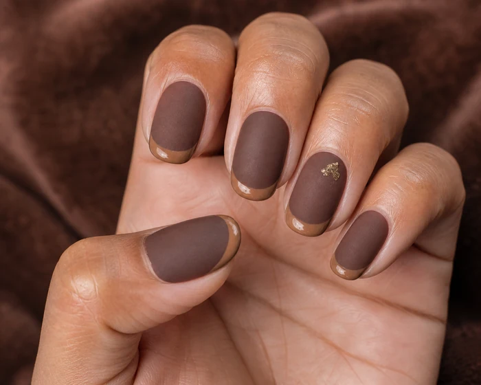 Mushroom matte November nails with glossy caramel tips and gold foil