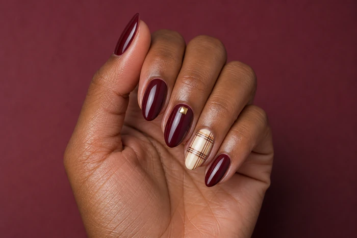 Cute burgundy Thanksgiving nails with plaid accent