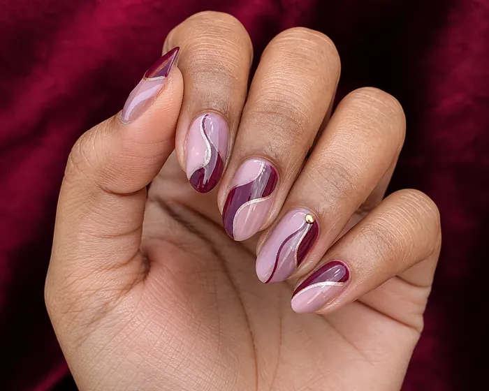 Burgundy and blush abstract ribbon almond nails