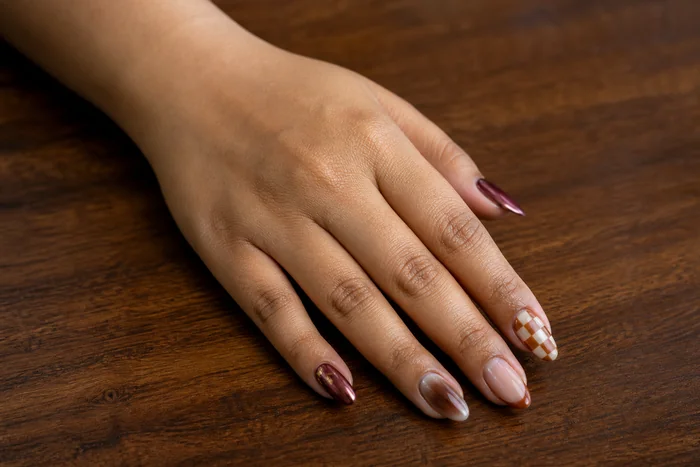 Mismatched fall nails with chrome and checker accents
