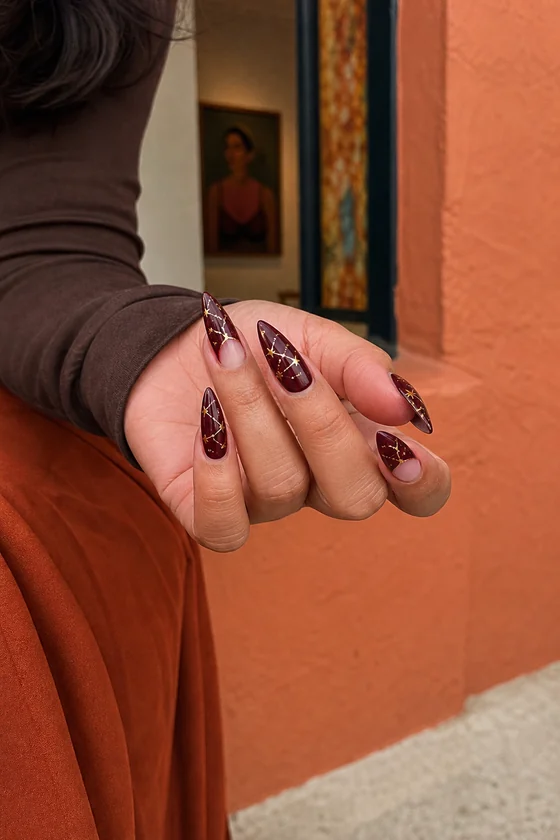 Merlot constellation nail art on long fall stiletto nails