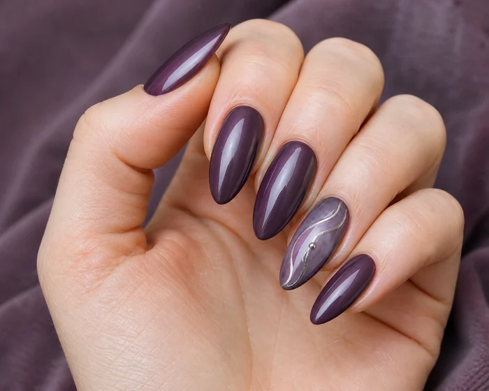 Long plum almond nails with silver chrome swirl