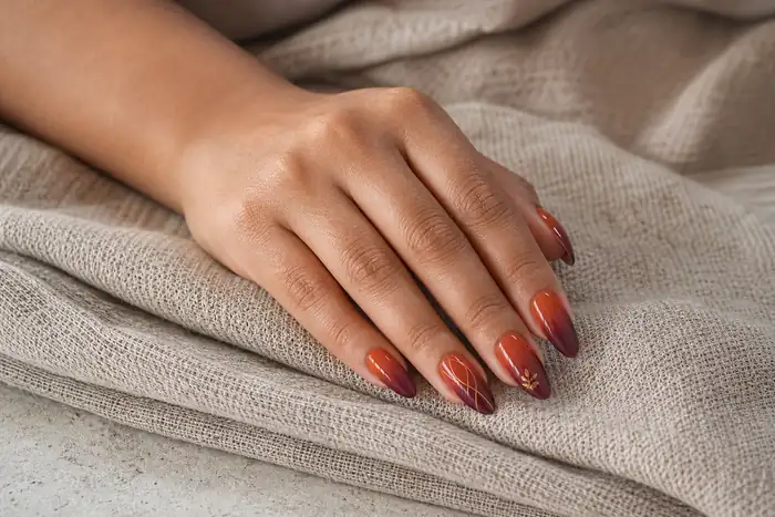 Rust to plum ombre acrylic nails with fine gold autumn art