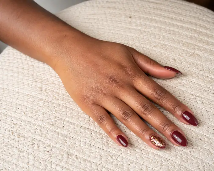 Burgundy almond dip powder nails for strength and length