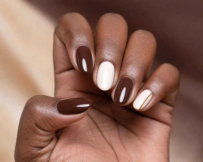 Simple chocolate and cream two-tone November nails with caramel line