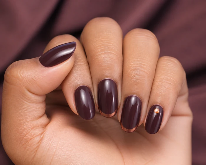 Plum nails with copper French tips
