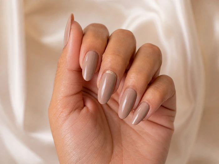 Toasted taupe Thanksgiving nails with a champagne half-moon