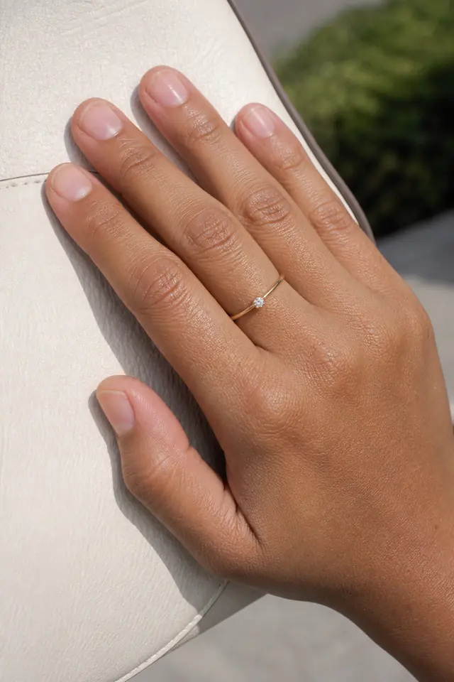 Bare natural nails with a clean glossy buffed finish.