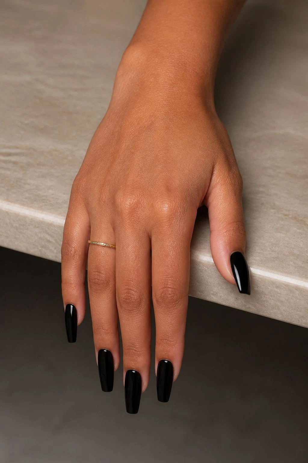 Long Black Coffin baddie Christmas nails with a delicate gold ring