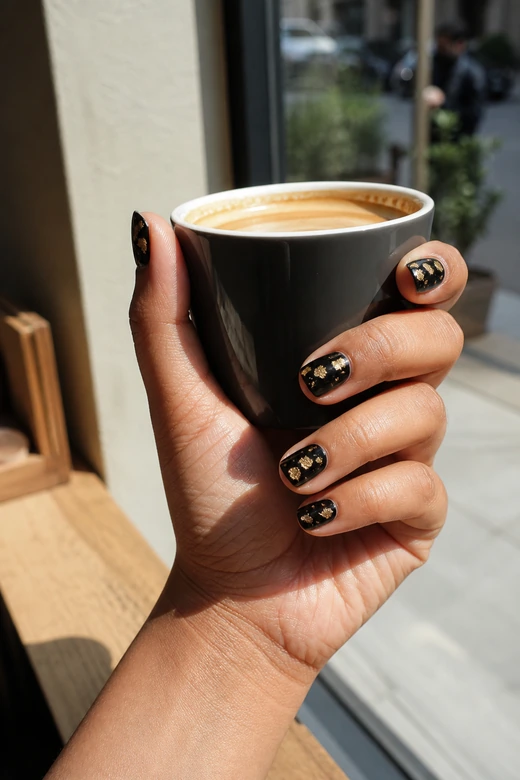 Black Christmas nails with antique gold foil