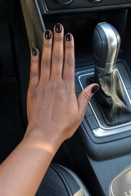 Black nails with delicate deep-red lines
