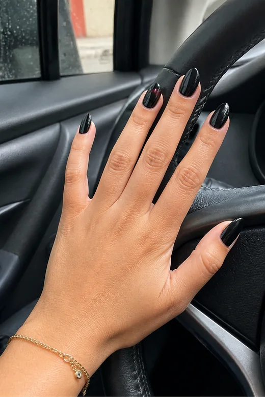 Black nails with a deep red French accent
