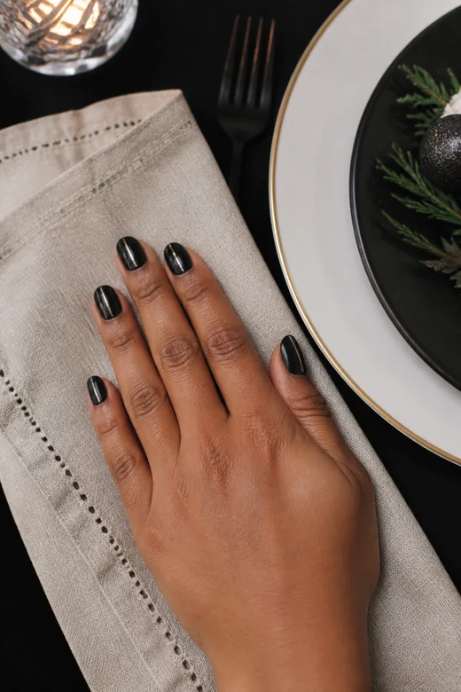 Black nails with a thin silver line accent