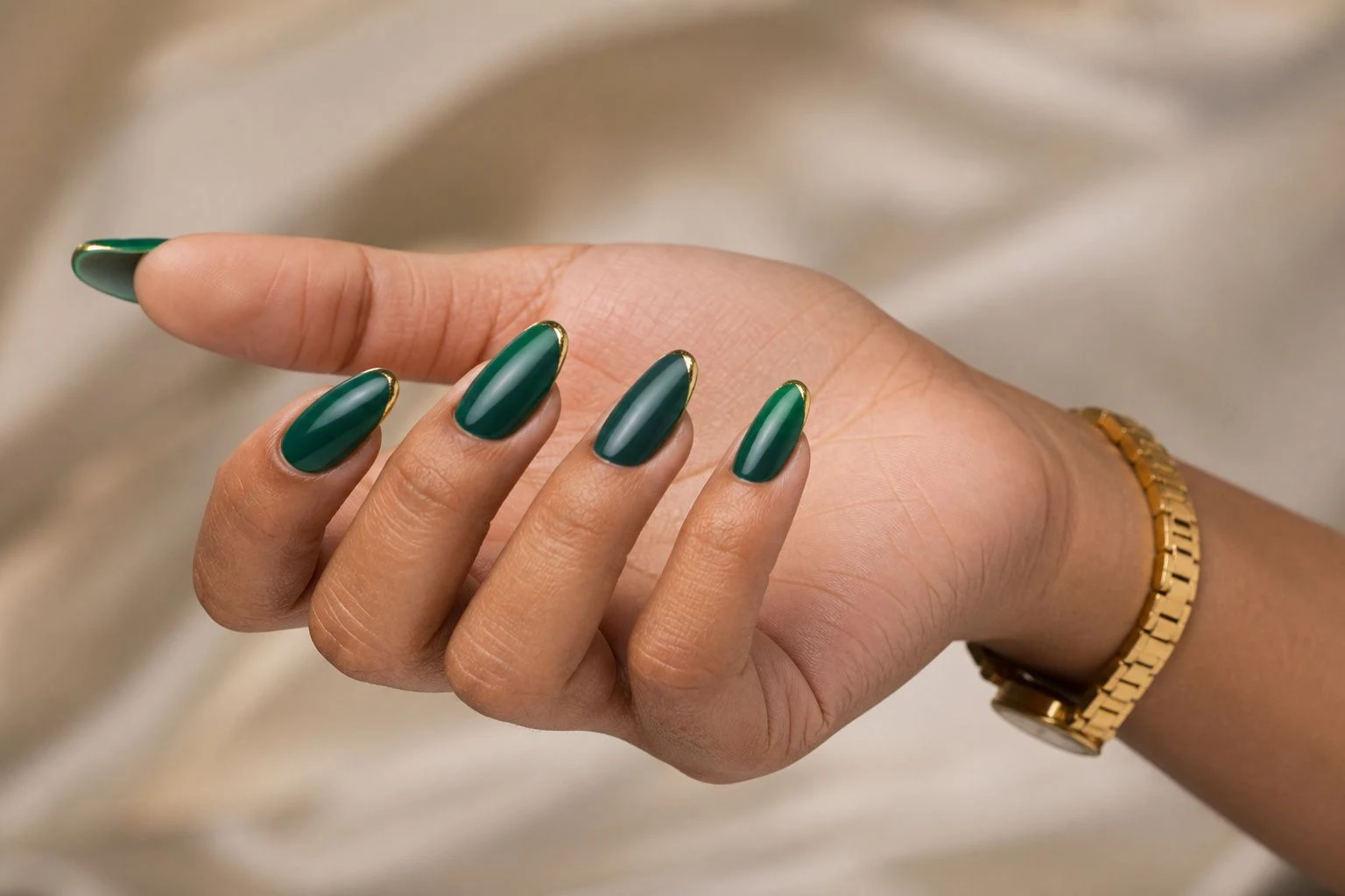 Emerald Gel French Christmas nails with a delicate gold watch