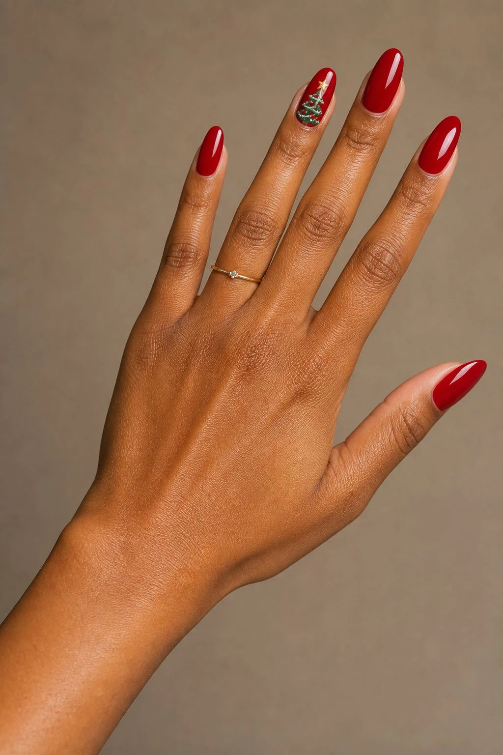 Decorated Red Tree Christmas nail art with a delicate gold ring