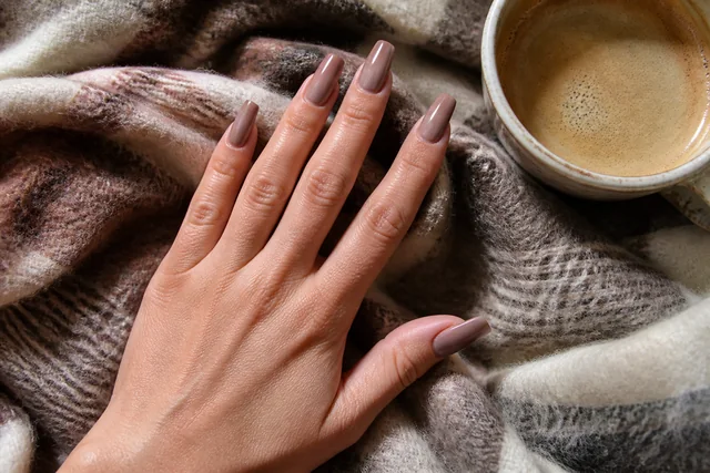 15 long ballerina fall nail inspo on a woman’s full hand.