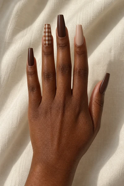 Deep cocoa gingham accent on moderate coffin nails with glossy finish, diagonal hand pose, deep brown skin tone