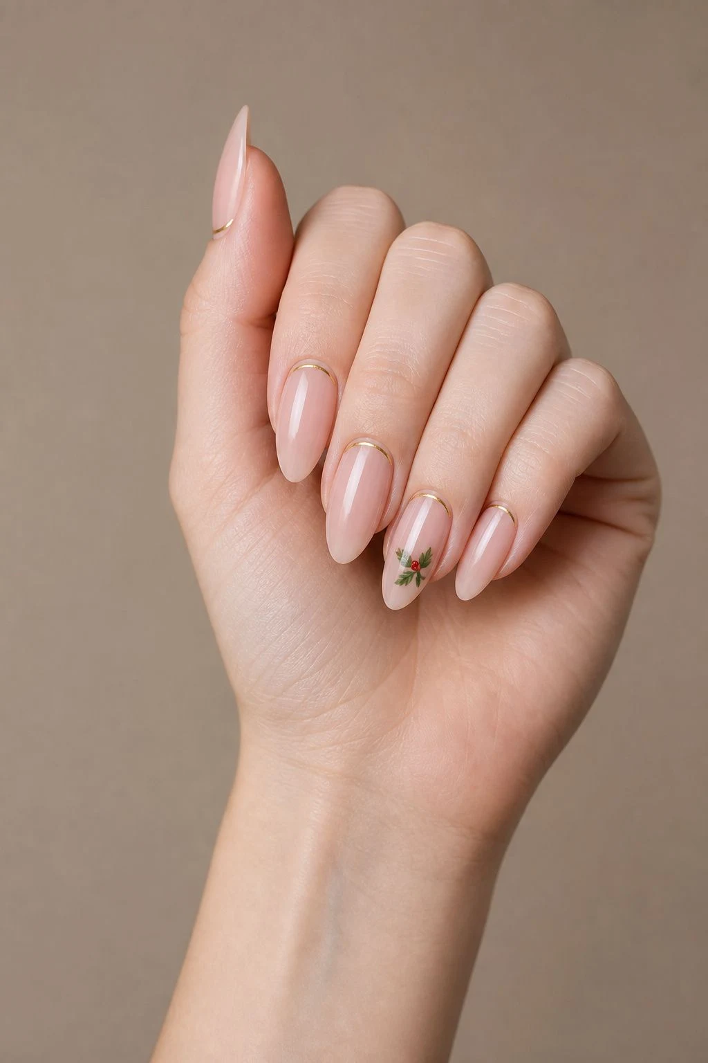 Mistletoe With Gold Line nail design in a curled hand pose with thumb clearly separated