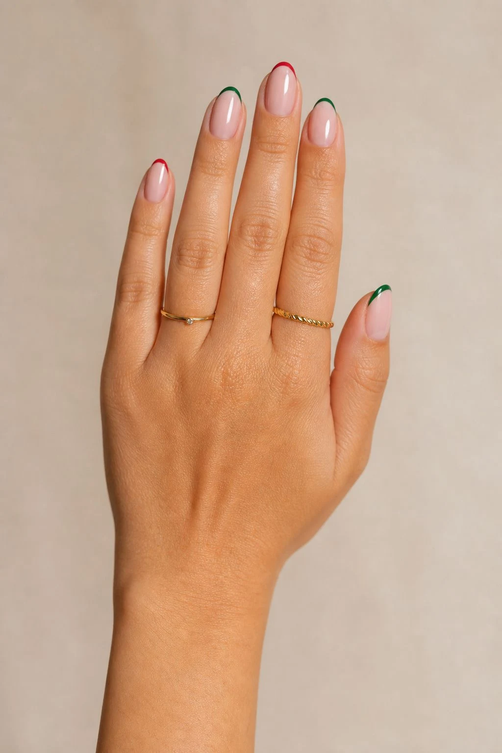Red and Green Micro French Christmas nails with delicate gold rings