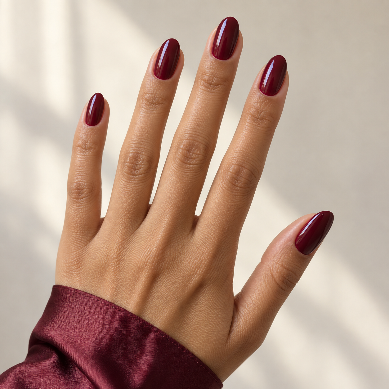 Oval burgundy manicure