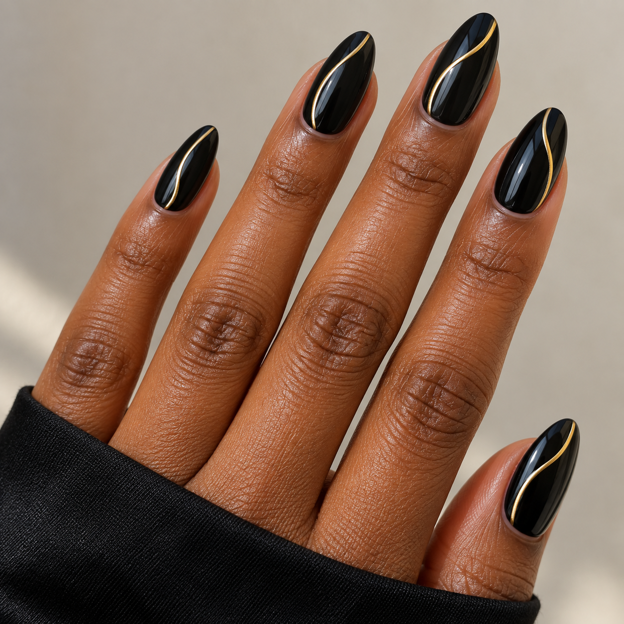 Gold detail nails for black dress